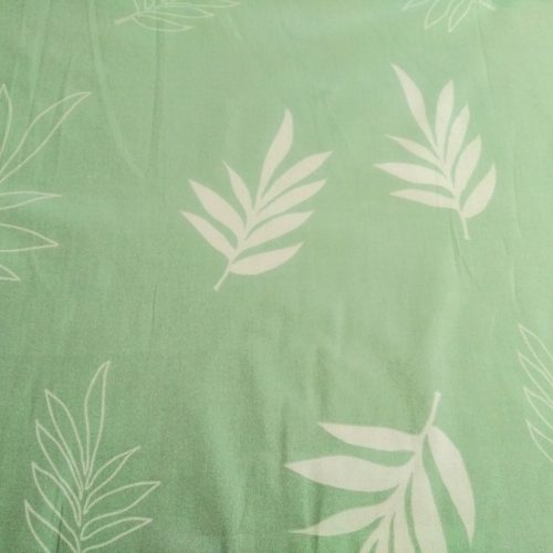 Pasztell zöld alapon levél mintás pamutvászon textil 160 cm széles